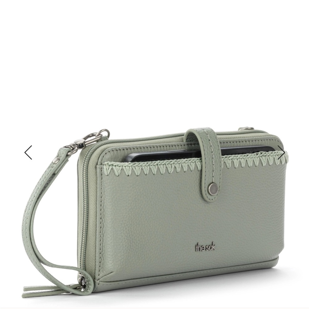 The Sak Wristlet Wallet. good used condition - blue/green color.